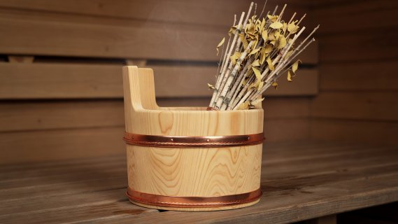 Rendered wooden cedar bucket with copper bands and dried birch vihta whisk